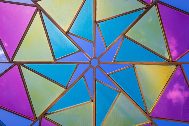 Colorful geometric mosaic pattern with triangular shapes, by Ole, age 7.